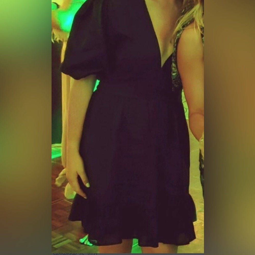 Black mini dress ruffles worn once. Faithful to the brand, linen material